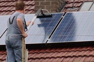 Man Cleaning Panels 300x200